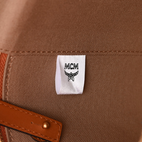MCM Calfskin Embossed Monogram Cylinder Crossbody Bag Cognac