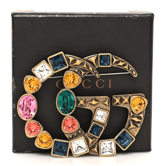 GUCCI クリスタル付き メタル ダブルG ブローチ Double G crystal flower brooch in antique gold-toned metal