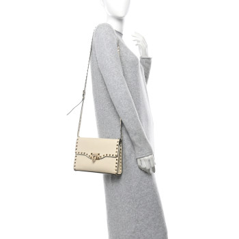 VALENTINO GARAVANI Pebbled Calfskin Medium Rockstud Flip Lock Crossbody Bag Light Ivory