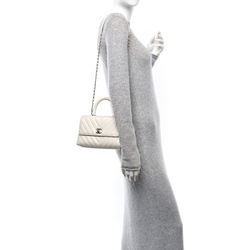 CHANEL Iridescent Caviar Chevron Quilted Mini Coco Handle Flap White