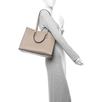 LOUIS VUITTON Empreinte Monogram Giant Onthego MM Tourterelle