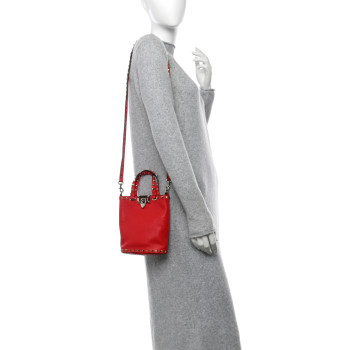 VALENTINO GARAVANI Pebbled Calfskin Rockstud Bucket Bag Red