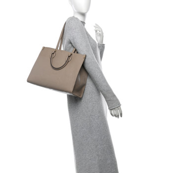 LOUIS VUITTON Empreinte Monogram Giant Onthego MM Tourterelle