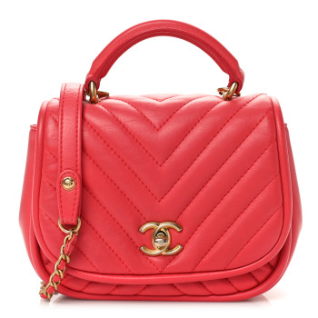 CHANEL Lambskin Reverse Chevron Quilted Mini Round Top Handle Flap Bright Pink
