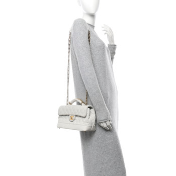 CHANEL Iridescent Caviar Quilted Medium Globe Trotter Flap White