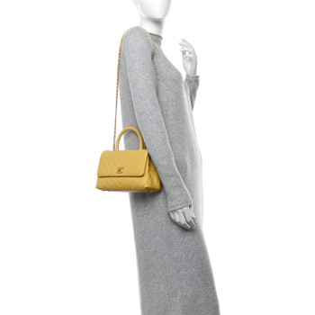 CHANEL Caviar Chevron Quilted Mini Coco Handle Flap Yellow