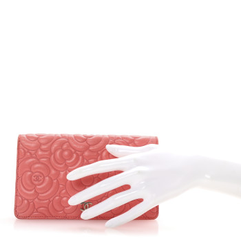 CHANEL Lambskin Camellia Embossed Yen Wallet Pink