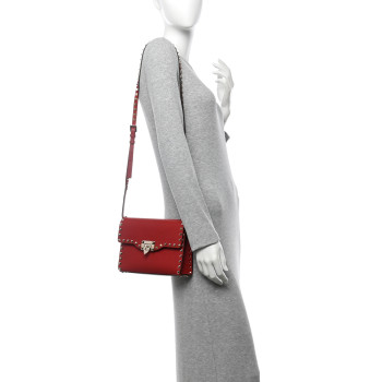 VALENTINO GARAVANI Pebbled Calfskin Medium Rockstud Flip Lock Crossbody Bag Red