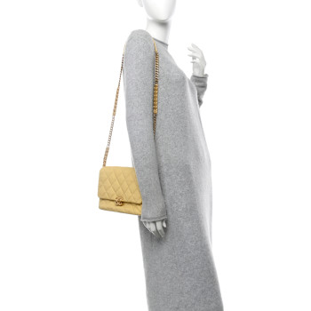 CHANEL Shiny Caviar Quilted Large Chain Melody Flap Yellow